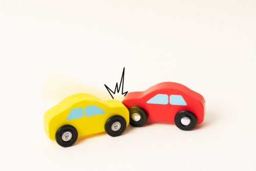 Two mini toy car crash with ambulance and police car. Toy car