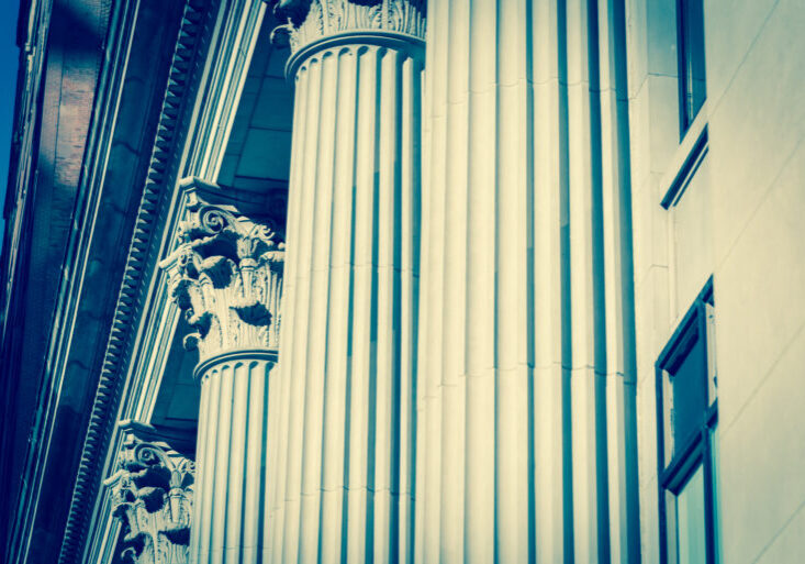 Lookup view union station pillars, government building columns in downtown Chicago, Illinois.